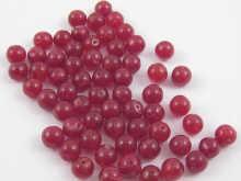 Appraisal: A quantity of loose polished drilled ruby beads total weight