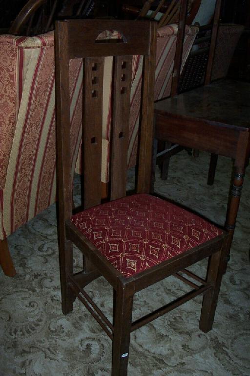 Appraisal: A set of oak dining chairs to a Mackintosh design