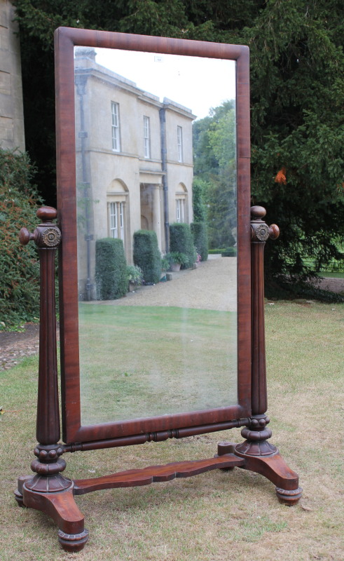 Appraisal: An early Victorian mahogany cheval dressing mirror with reeded columns