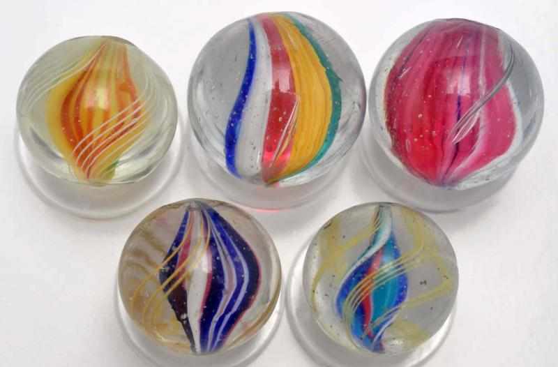 Appraisal: Lot of Single Ribbon Swirl Marbles Description Includes five multicolored