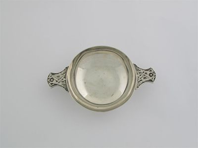 Appraisal: A modern quaich with zoomorphic handles inscribed in cm wide