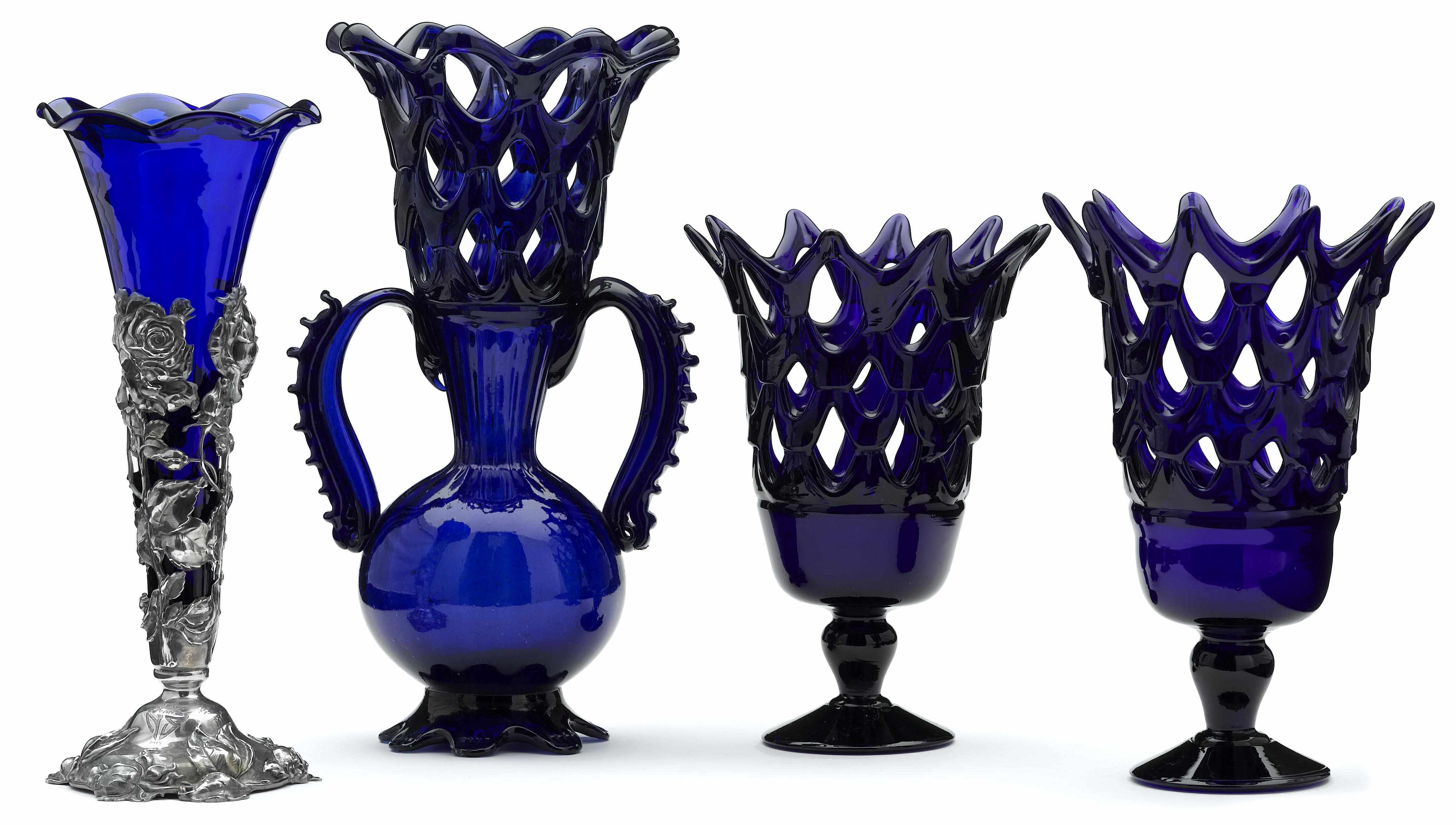 Appraisal: A Continental cobalt blue glass reticulated three piece garniture and