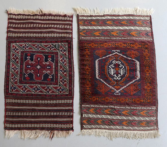 Appraisal: TWO BELOUCH TRIBAL RUGS with stylised central motif and flat