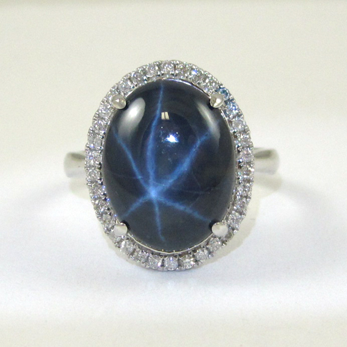 Appraisal: STAR SAPPHIRE AND FOURTEEN KARAT WHITE GOLD RING with round-cut