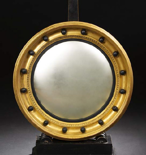 Appraisal: English Regency Carved and Parcel-Ebonized Giltwood Bull's-Eye Looking Glass third