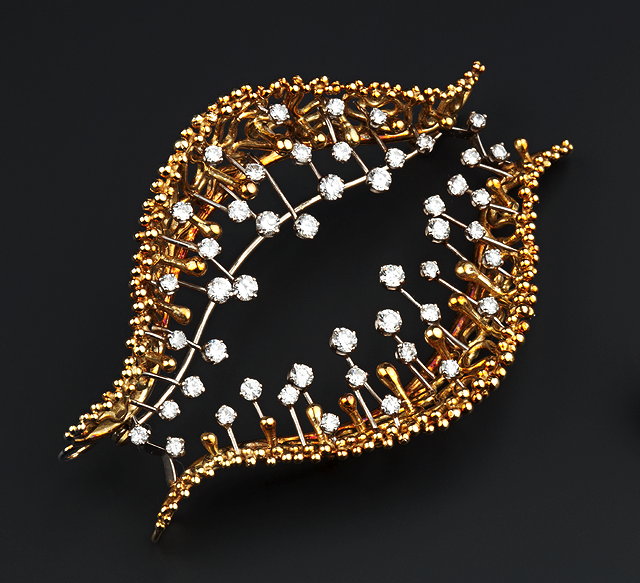 Appraisal: AN CT GOLD AND DIAMOND SET BROOCH PENDANT ATTRIBUTED TO