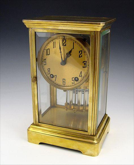 Appraisal: FRENCH CRYSTAL REGULATOR CLOCK Brass case with beveled glass sides