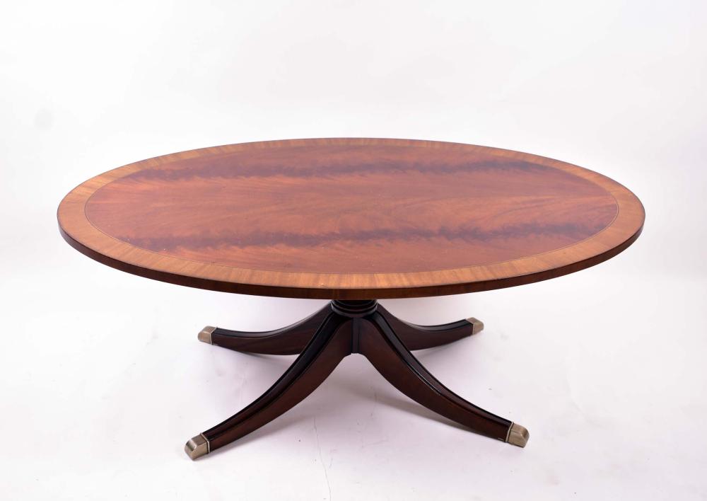 Appraisal: GEORGE III STTYLE INLAID MAHOGANY COCKTAIL TABLEModern The oval cross-banded