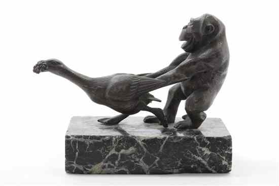 Appraisal: A Bronze Animalier Group depicting a monkey with a swan