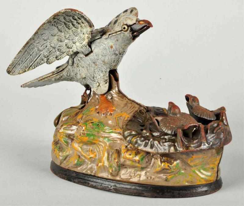 Appraisal: Cast Iron Eagle Eaglettes Mechanical Bank Manufactured by J E