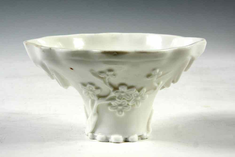 Appraisal: BLANC-DE-CHINE CUP - Chinese Blanc-de-Chine Rhinoceros Horn Form Libation Cup