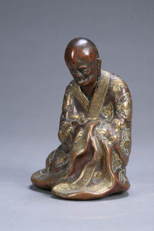 Appraisal: STATUE OF A ROBED MAN Asian th century copper Probably