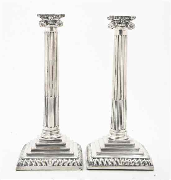 Appraisal: A Pair of Sheffield Plate Candlesticks in the form of