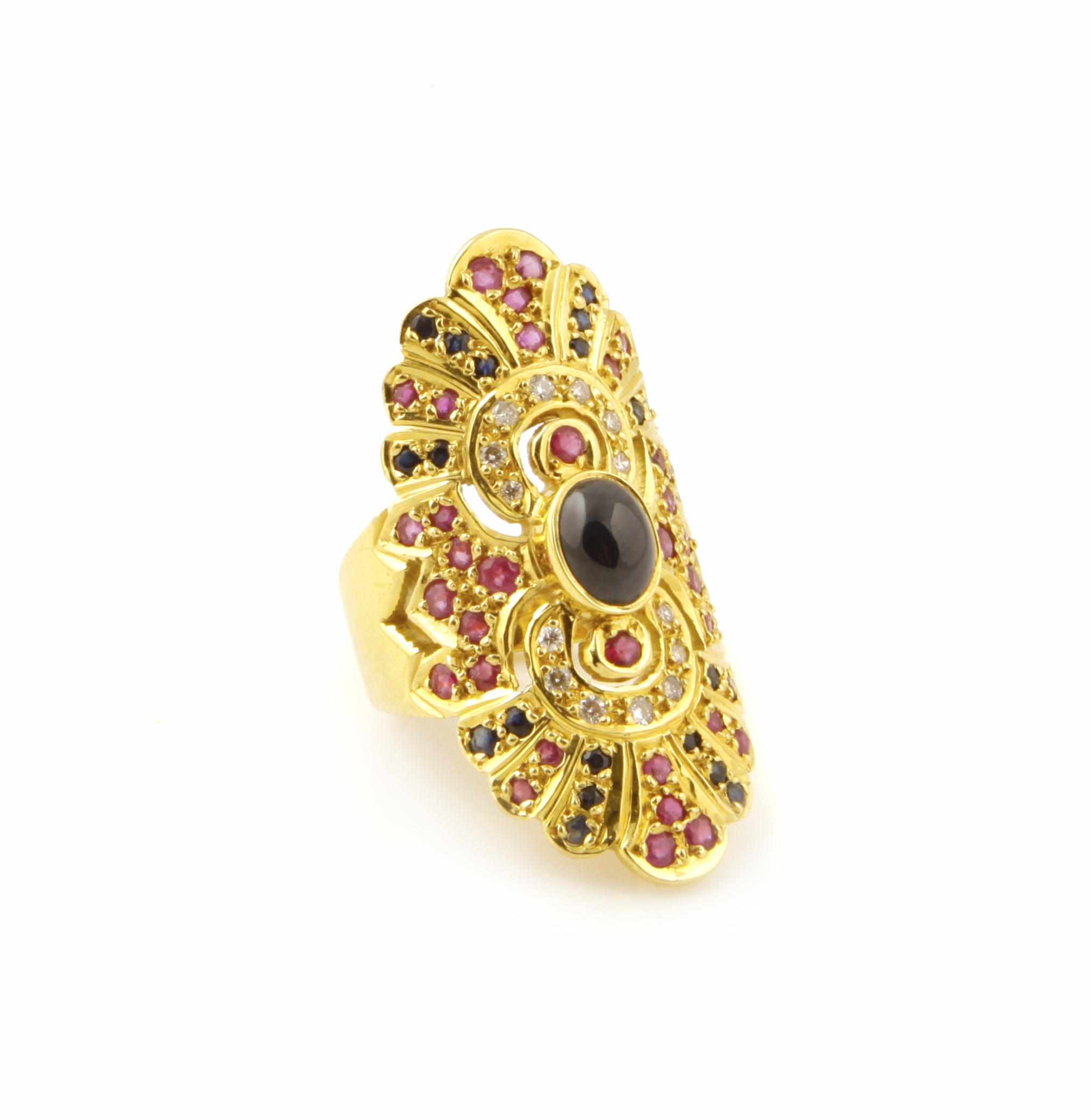 Appraisal: A ruby sapphire diamond and k gold cigar band ring