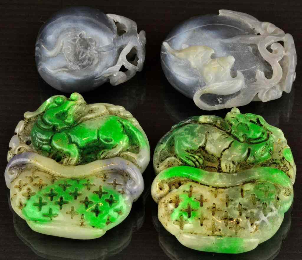 Appraisal: Chinese Carved Jade PendantsTo include two purple jade carvings depicting