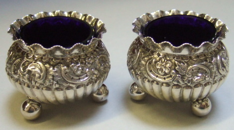 Appraisal: A pair of Victorian silver salts each with partly fluted