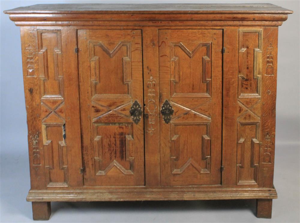 Appraisal: CONTINENTAL BAROQUE OAK PANELLED AND CARVED CABINET having a rectangular