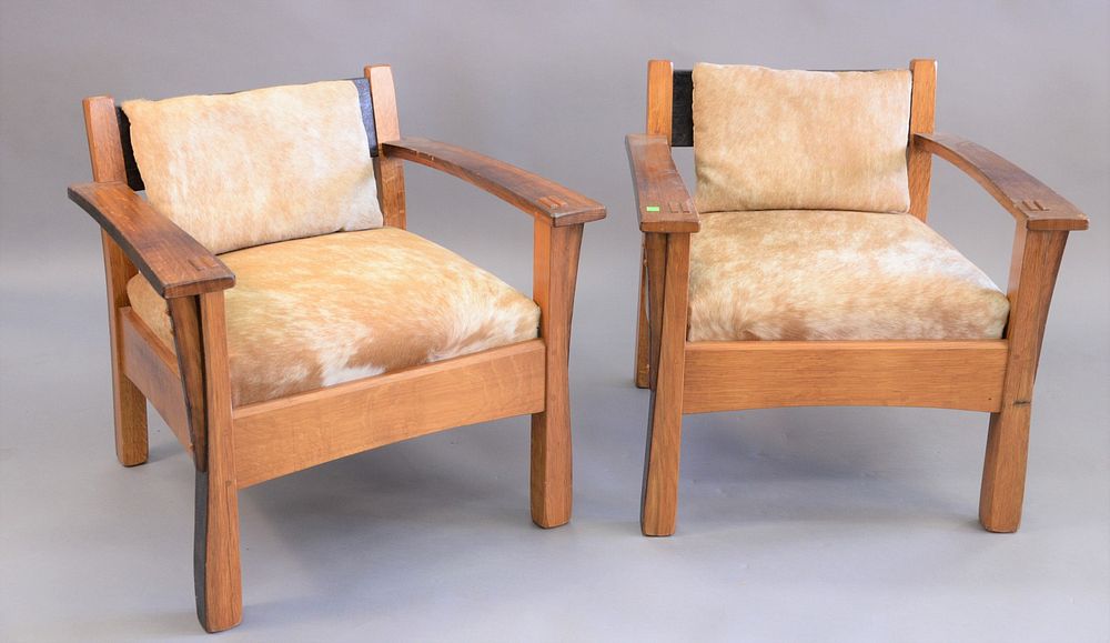 Appraisal: Whit Mcleod mission oak style armchairs with cow hide cushions