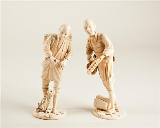 Appraisal: Two Japanese Ivory Okimono both of men a fisherman taking