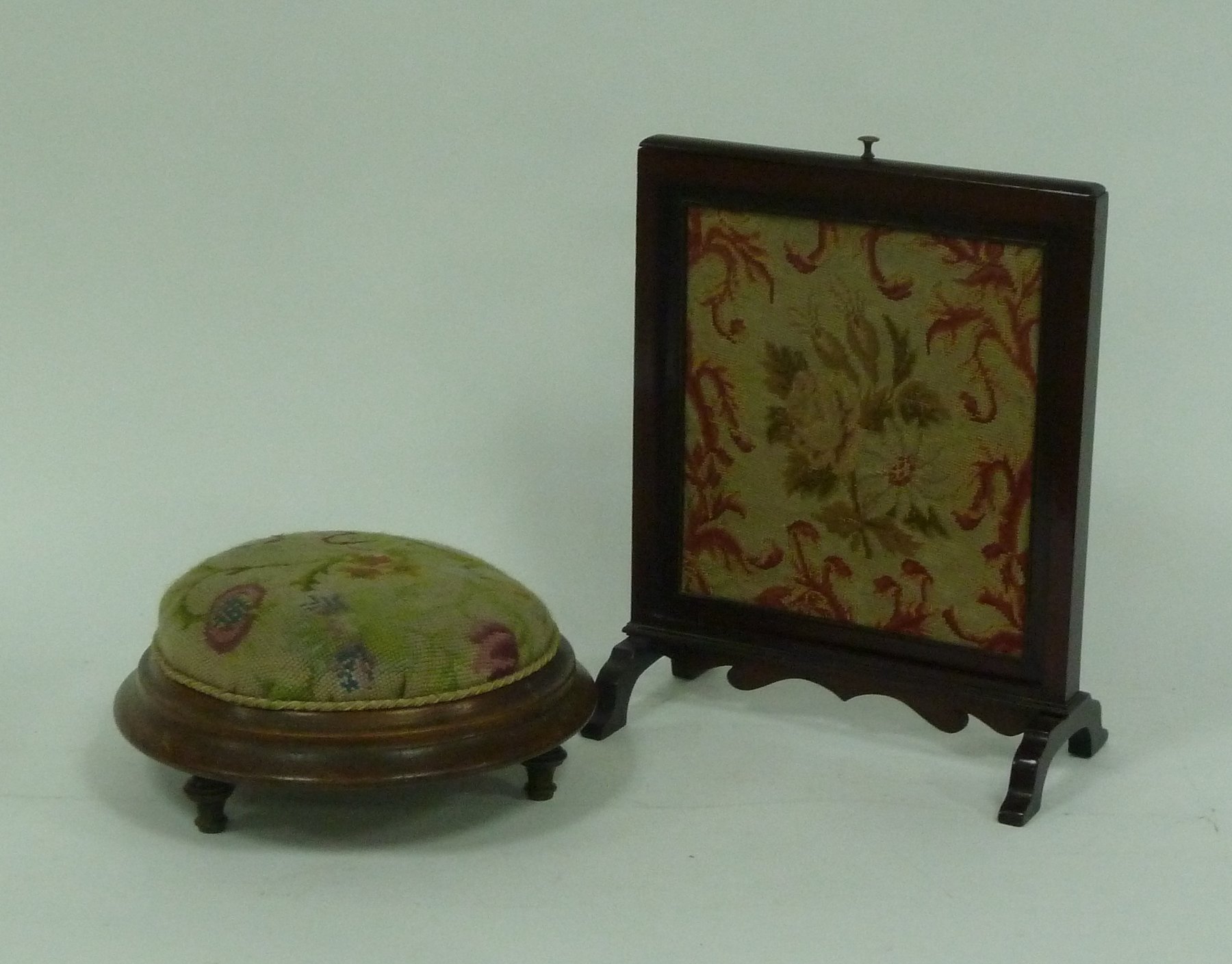 Appraisal: A small mahogany framed needlework table screen cm high and