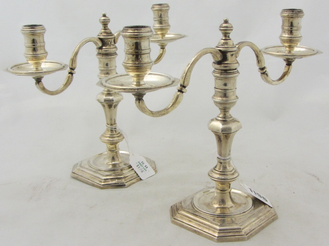 Appraisal: A pair of silver twin light candelabra in an th