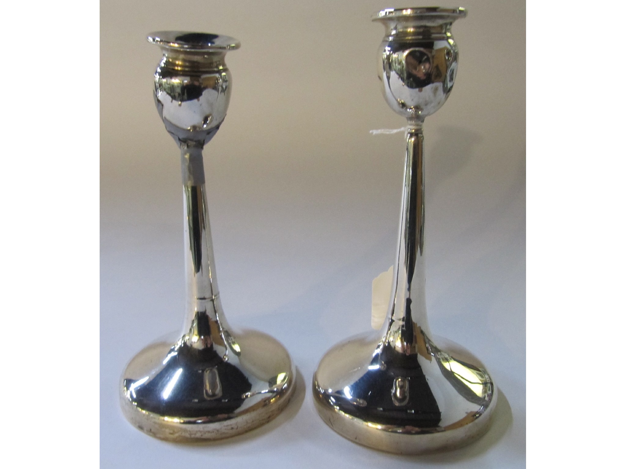 Appraisal: A pair of silver candlesticks one def Birmingham