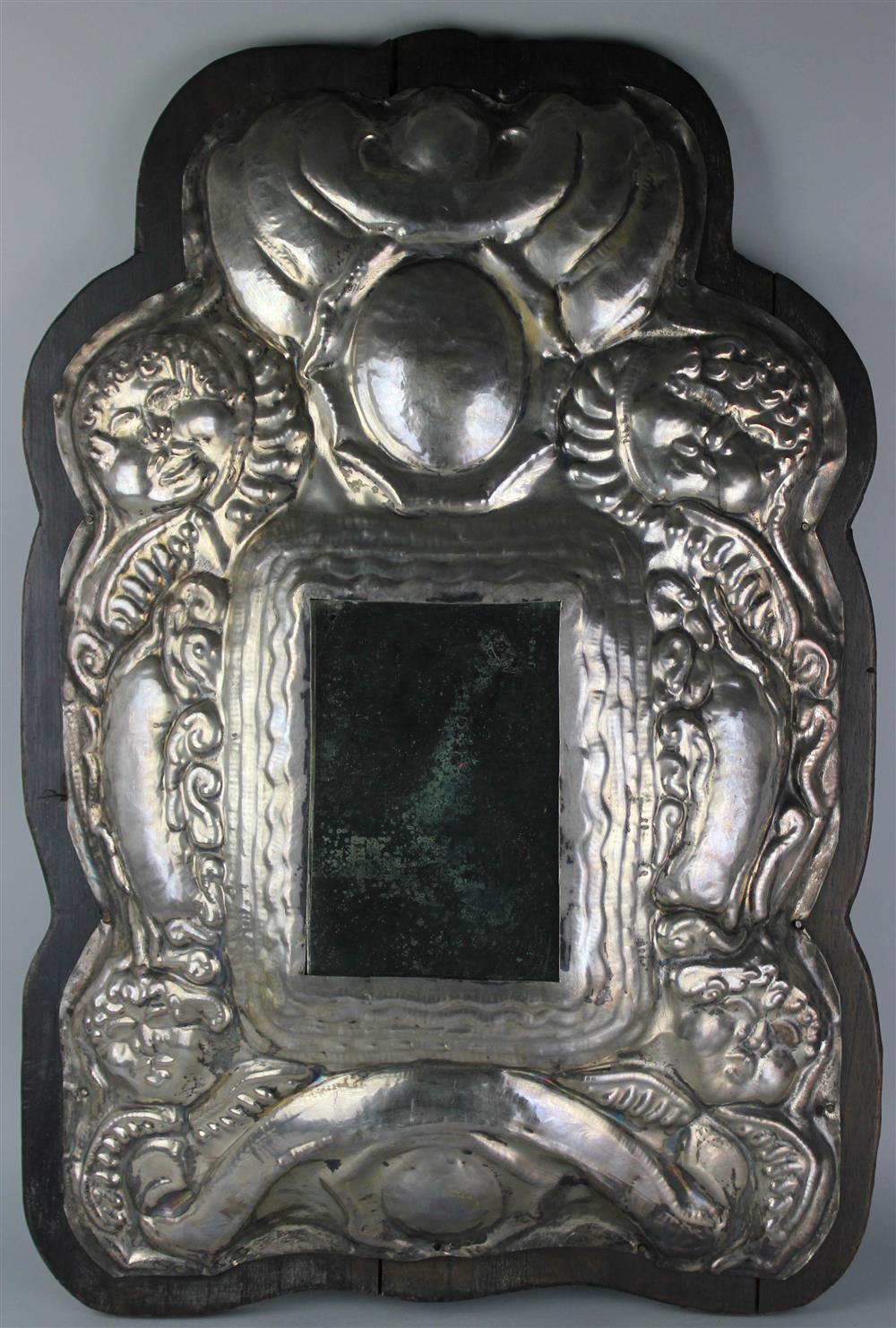 Appraisal: SPANISH COLONIAL STYLE SILVER MIRROR apparently unmarked the convex frame