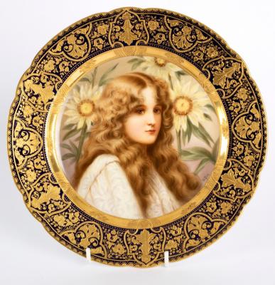 Appraisal: A Vienna style plate painted a maiden amongst sunflowers signed