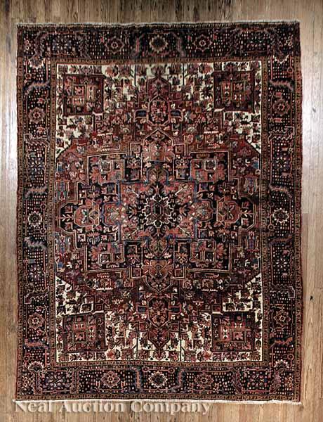 Appraisal: A Persian Heriz Carpet blue salmon red and cream ground