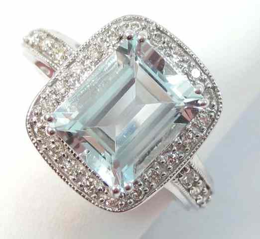 Appraisal: AQUAMARINE AND DIAMOND RING k white gold centering an emerald-cut