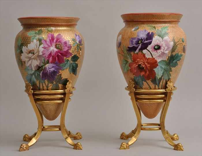 Appraisal: PAIR OF FRENCH POTTERY VASES ON GILT-METAL STANDS Each ovoid