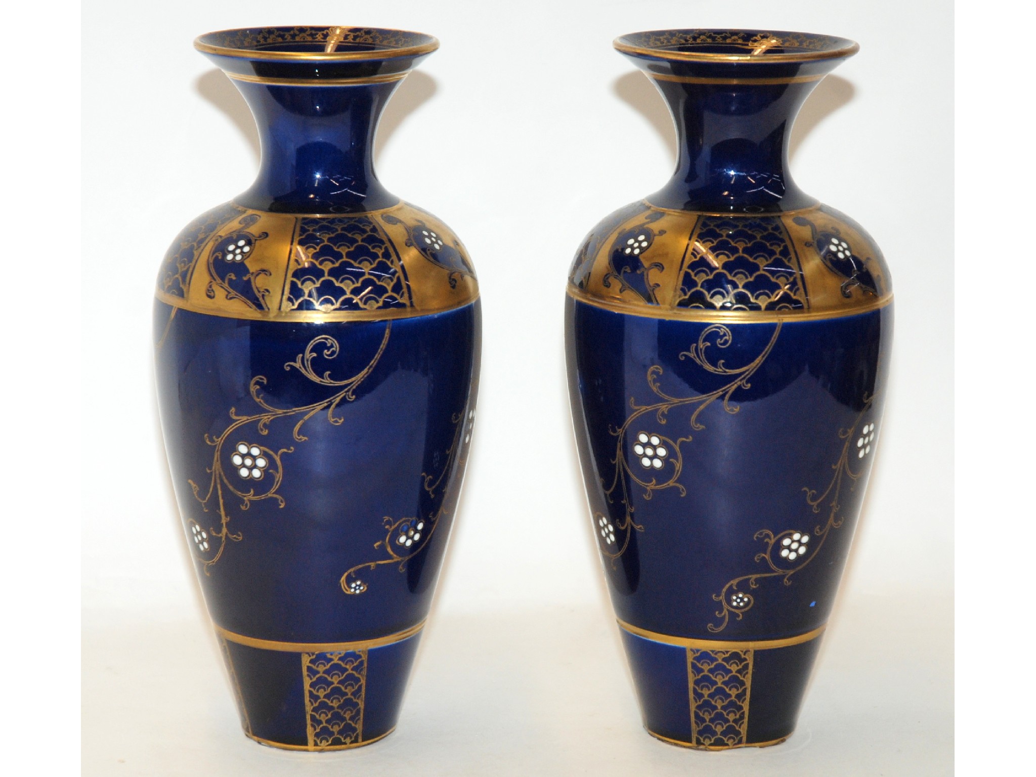 Appraisal: A pair of Macintyre blue glazed vases with gilt and