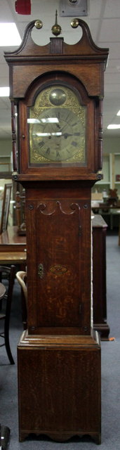 Appraisal: An oak cased eight-day longcase clock the hood with broken