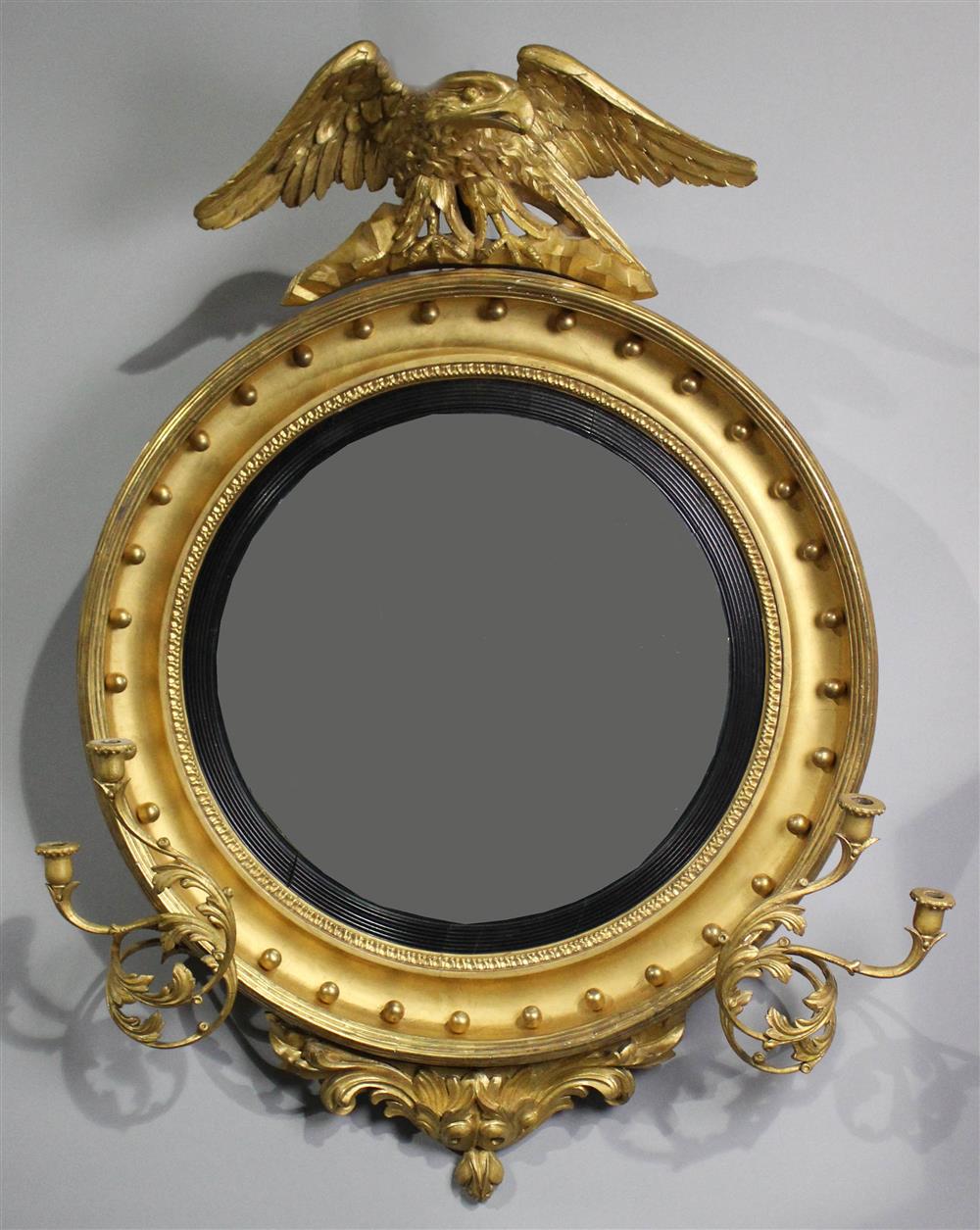 Appraisal: CLASSICAL GILTWOOD CONVEX MIRROR CIRCA the circular convex mirror within