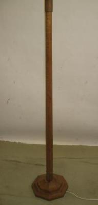 Appraisal: AN ADZED OAK STANDARD LAMP by Wilfred Squirrel Man Hutchinson