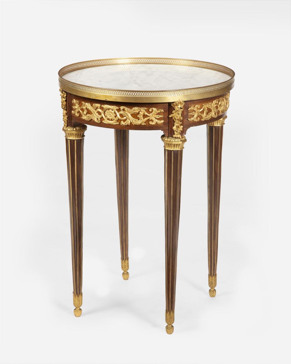 Appraisal: A Louis XVI-style marble-topped gueridon table First-half th Century The