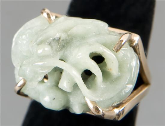 Appraisal: Jade ring with a sculpture of a dragon set in