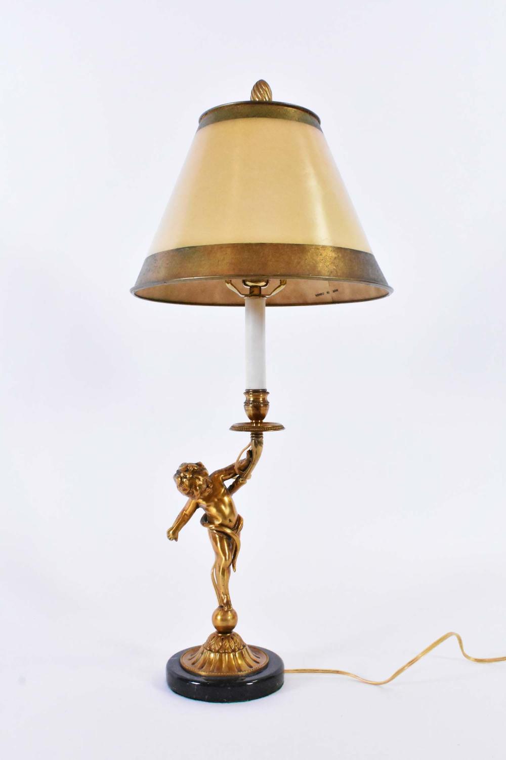 Appraisal: ROCOCO STYLE GILT BRONZE PUTTI CANDLESTICK LAMPOn a circular marble