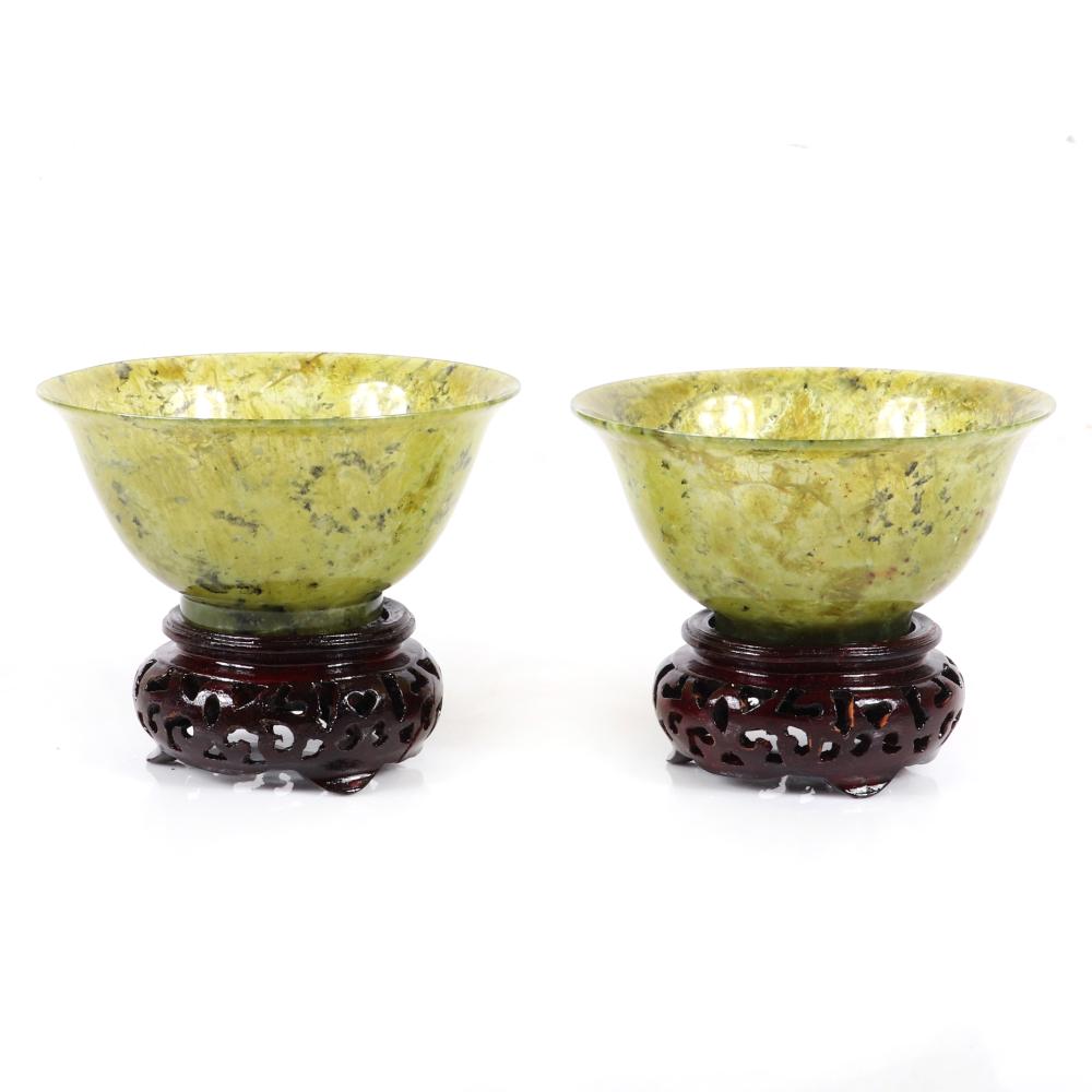 Appraisal: PAIR CARVED CHINESE SPINACH JADE BOWLS WITH CARVED WOOD STANDS