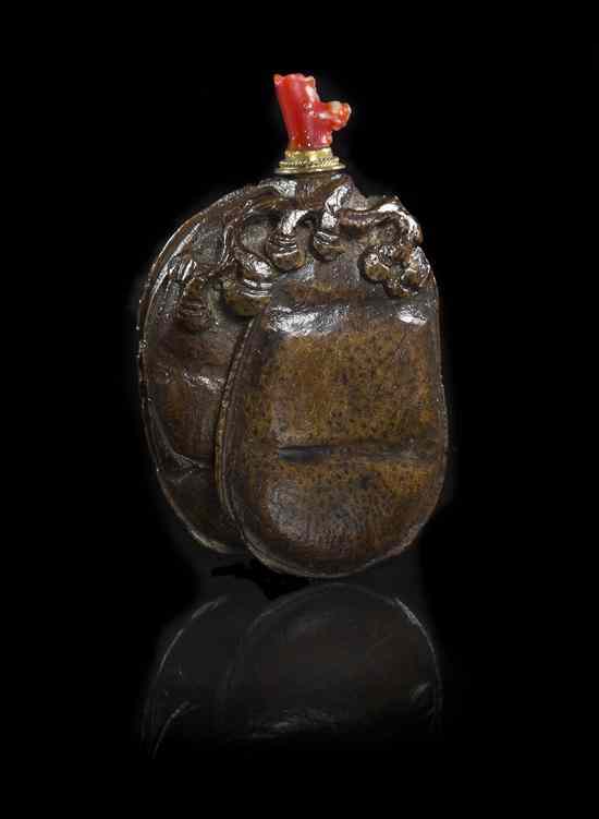 Appraisal: A Carved Seed Pod Snuff Bottle in the form of