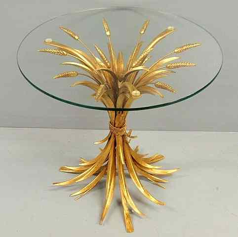 Appraisal: Sheaf-of-wheat gilt decorated metal base table with a round glass