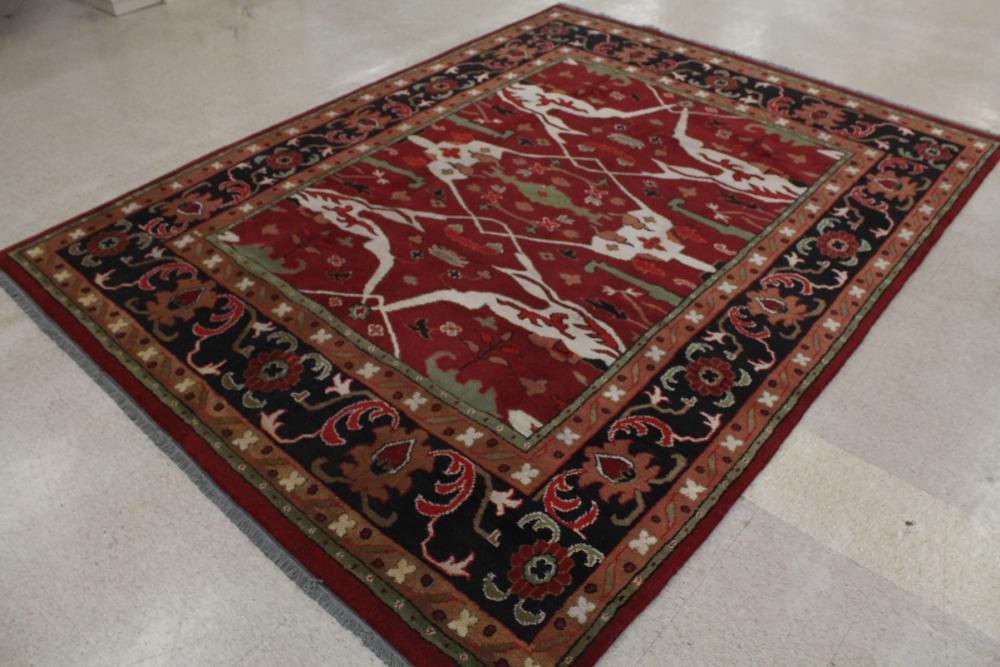 Appraisal: HAND KNOTTED ORIENTAL CARPET Indo-Persian stylized floral curvilinear design on