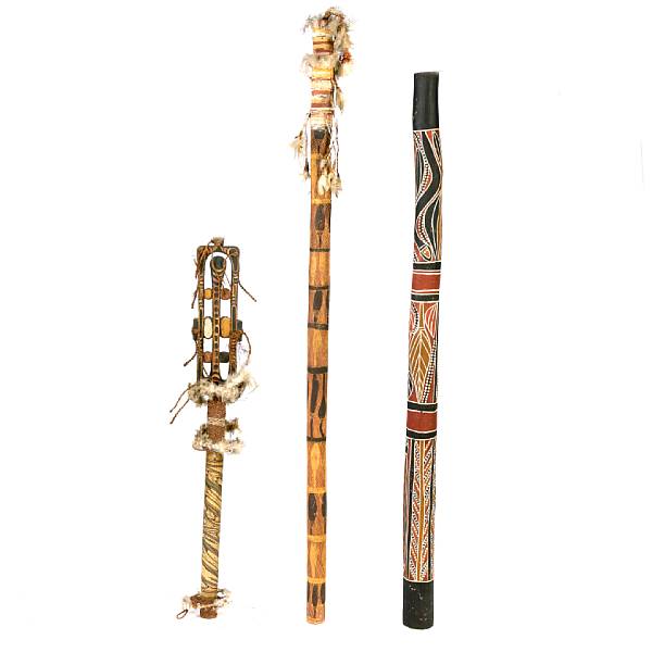 Appraisal: An aboriginal didgeridoo together with two bamboo and feather staffs