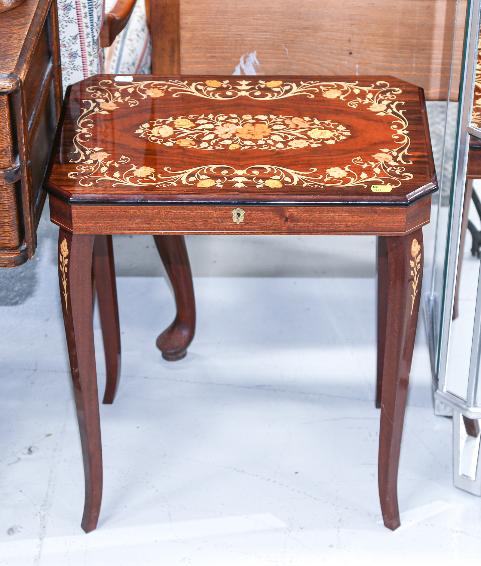 Appraisal: ITALIAN MARQUETRY MUSIC BOX TABLE Modern tinted wood veneers on