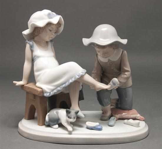 Appraisal: Lladro porcelain figural group ''Try This One'' no modeled as