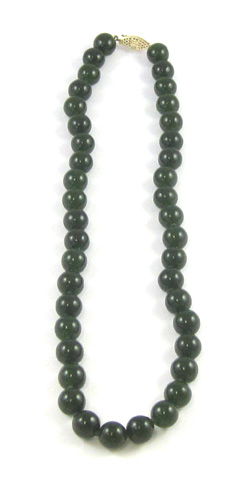 Appraisal: DARK GREEN HARDSTONE NECKLACE measuring - inches in length and