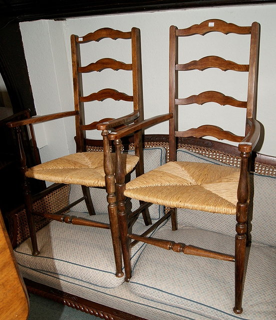 Appraisal: Pair of beech ladder back armchairswith rush seats