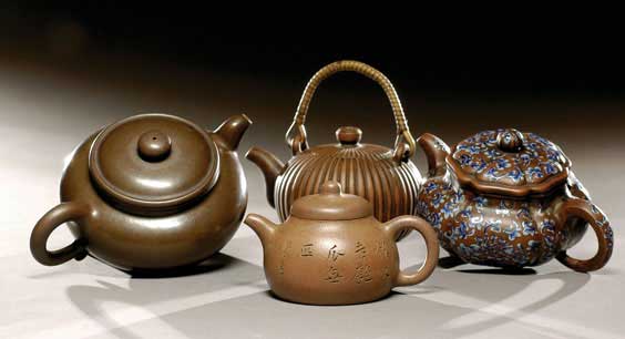 Appraisal: FOUR YIXING POTTERY TEAPOTS Group of four antique Chinese Yixing