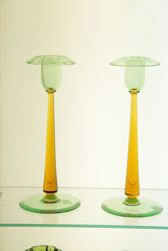 Appraisal: PAIR OF STEUBEN ART GLASS CANDLESTICKS Green sockets and bases