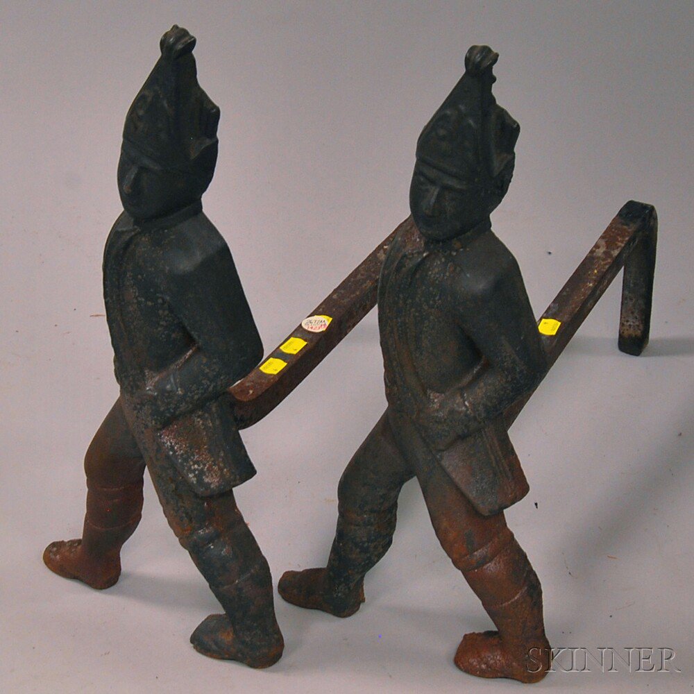 Appraisal: Pair of Cast Iron Hessian Andirons th century corrosion ht